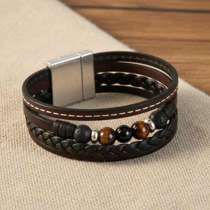 Manchette TRÉCHIC 4 Cuirs Choco horizons boutique : bracelet en cuir marron à 4 tours avec œil de tigre, pierres de lave et onyx, fermoir magnétique argenté.